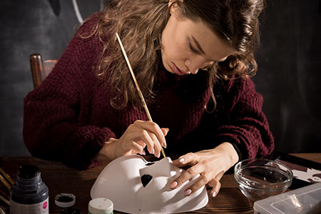Girl Painting a Mask