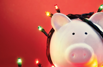 Piggy bank covered in holiday lights