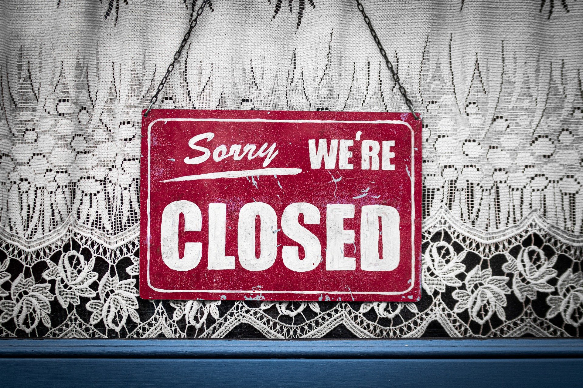 Sorry We're Closed sign in window
