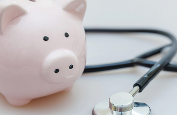 A piggy bank getting a check-up at the doctor