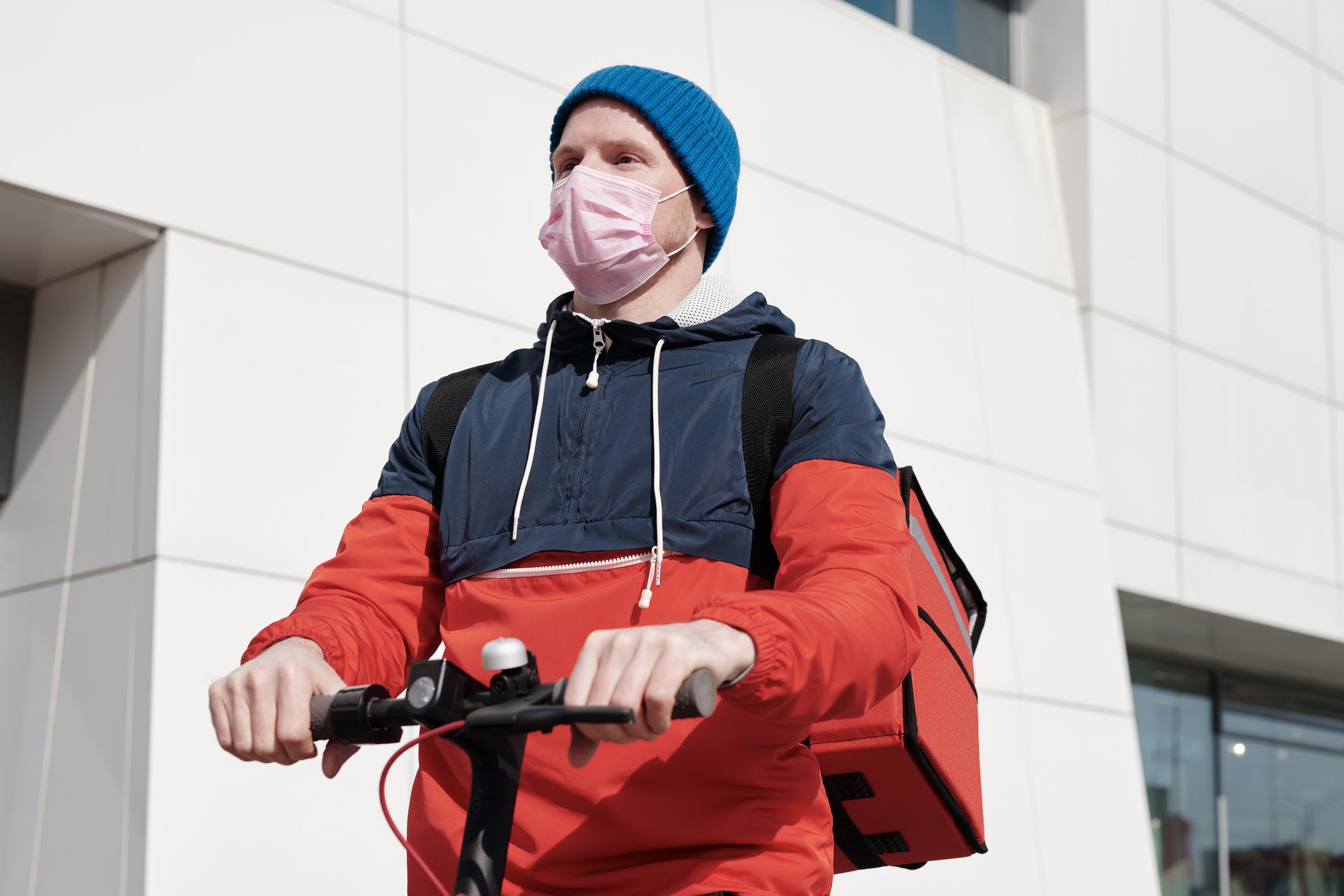 man on bicyle wearing a mask